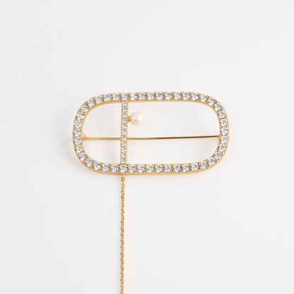 Symphony signature brooch